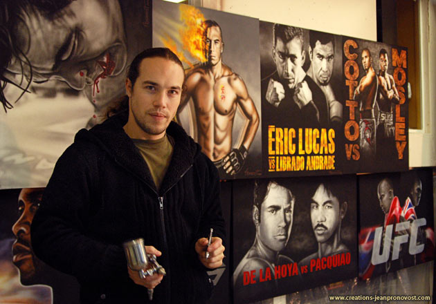 Montreal airbrush artist Jean Pronovost in front of his fighters serie 